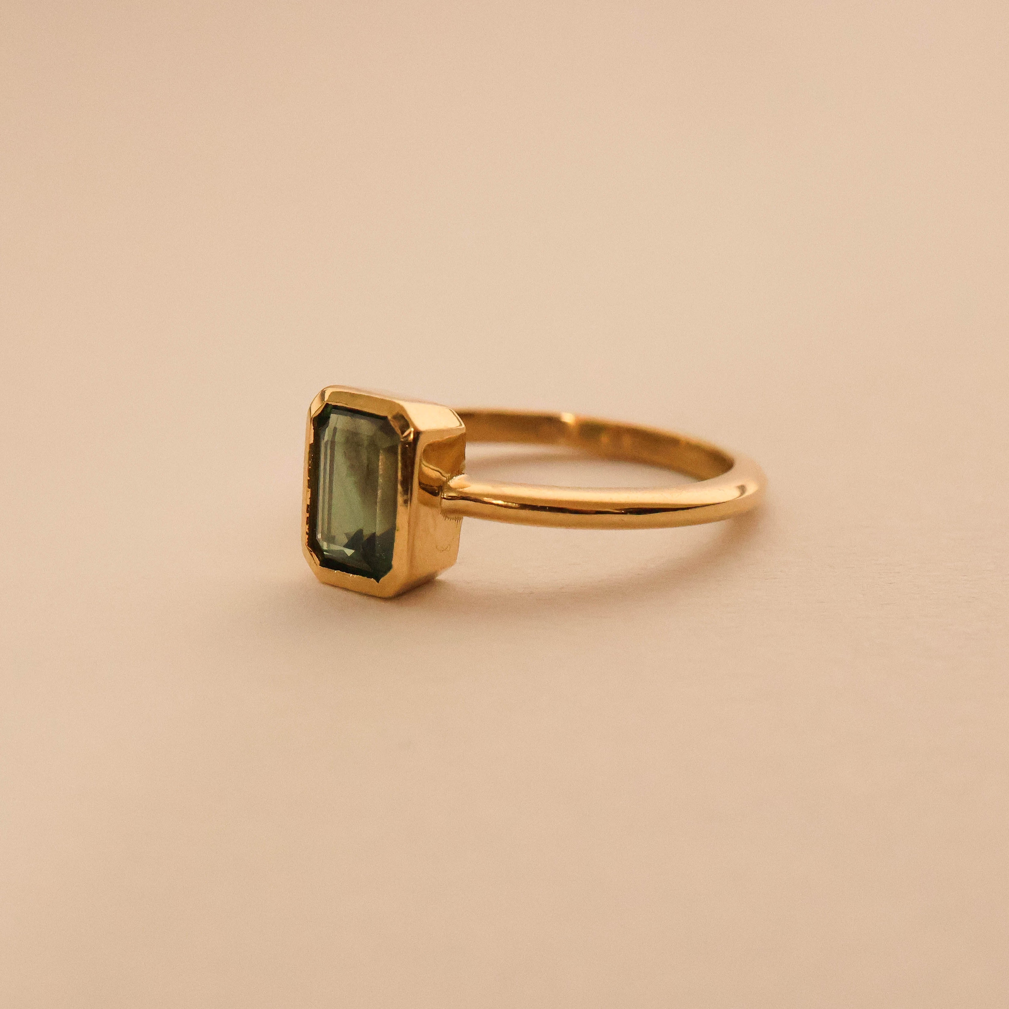 Emerald Cut Sapphire Bezel Solitaire