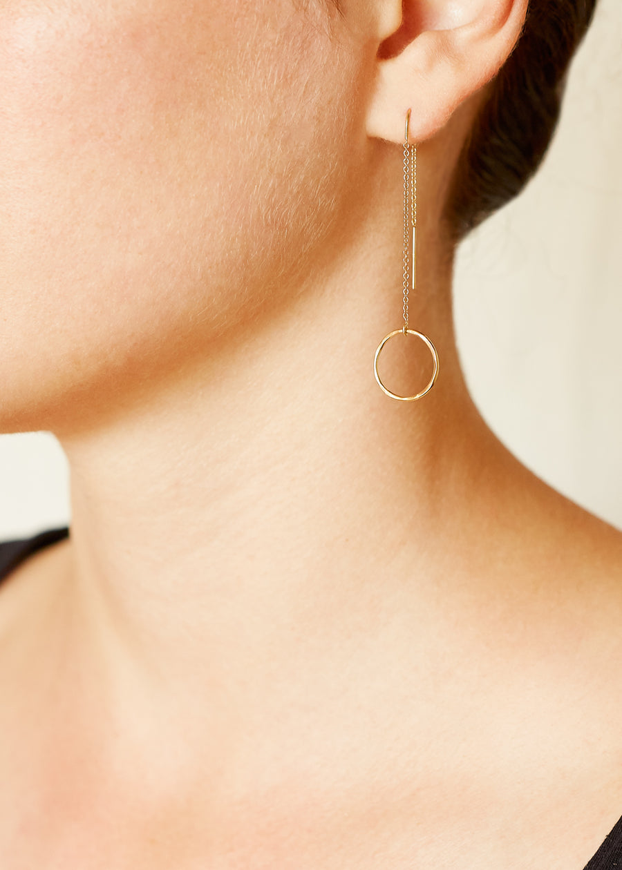 A model wearing A pair of Gold Plated 925 Sterling Silver Thread Earrings with Circle Charms